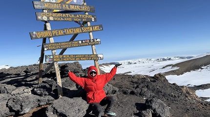Janella at the top of Mount Kilimanjaro