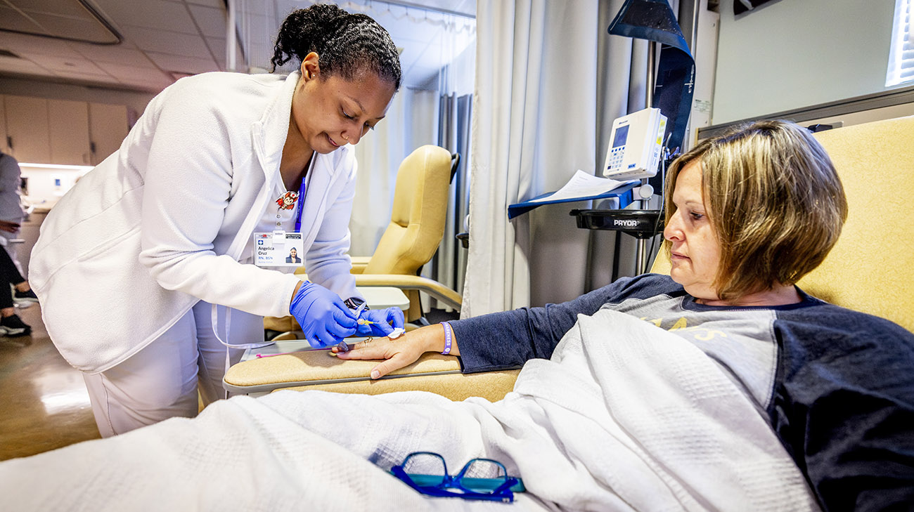 Melissa receiving a lecanemab infusion at Cleveland Clinic Mellen Center. 