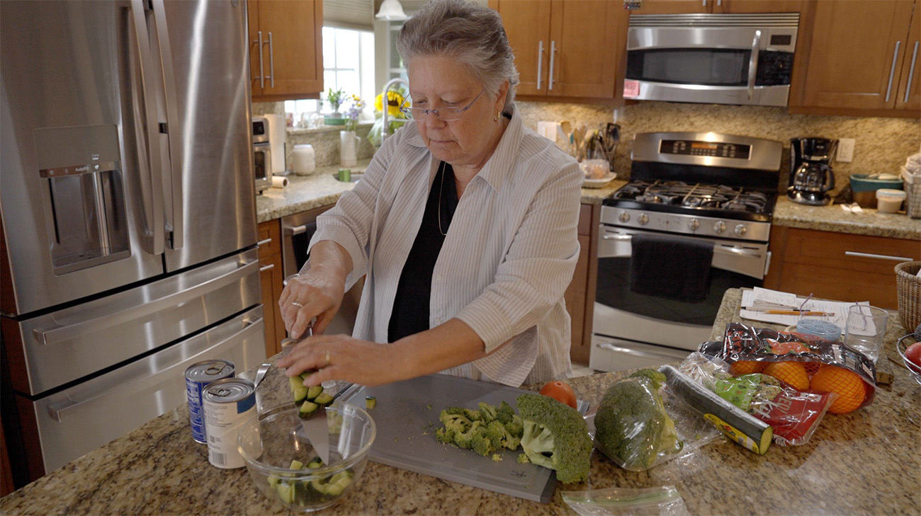 Donna Marie Caruso making a healthy meal after her rectal cancer surgery
