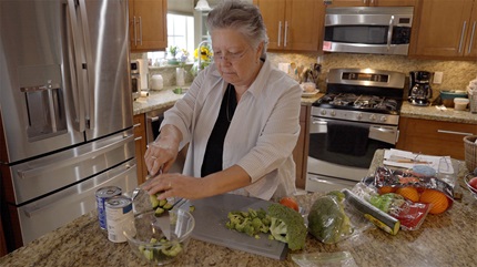 Donna Marie Caruso making a healthy meal after her rectal cancer surgery