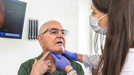 patient with dysphonia getting a check up.