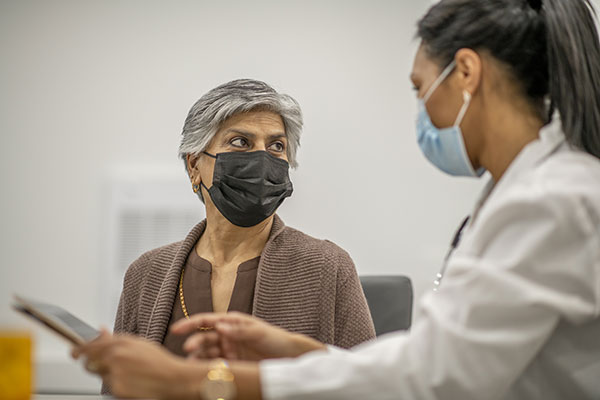 Cleveland Clinic doctor talking with patient.